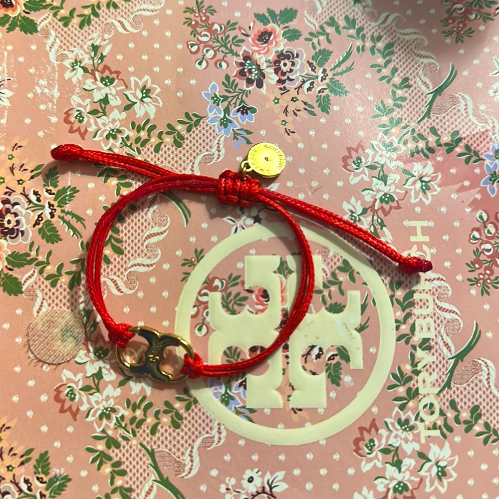 Tory Burch red ribbon bracelet retailed $35